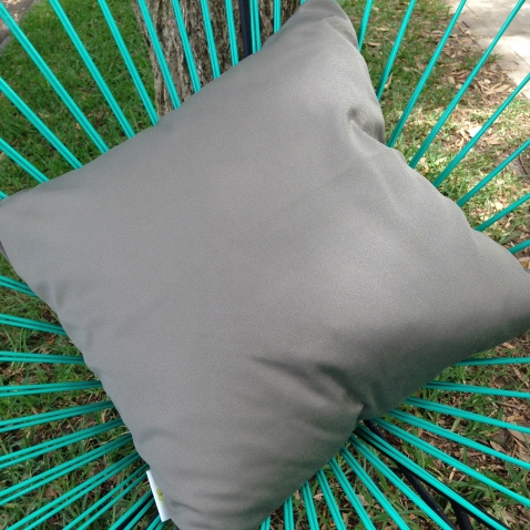 Khaki outdoor cushion cover on chair